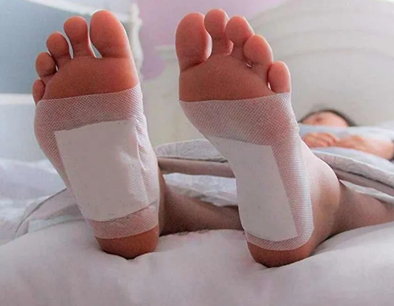 Nuubu Detox Foot Patch applied to the sole of the foot